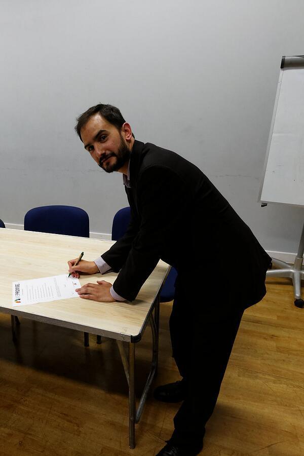 Green European Parliament candidate Audaye Elesedy signs the Charter of Digital Rights at St Werburgh's Community Centre