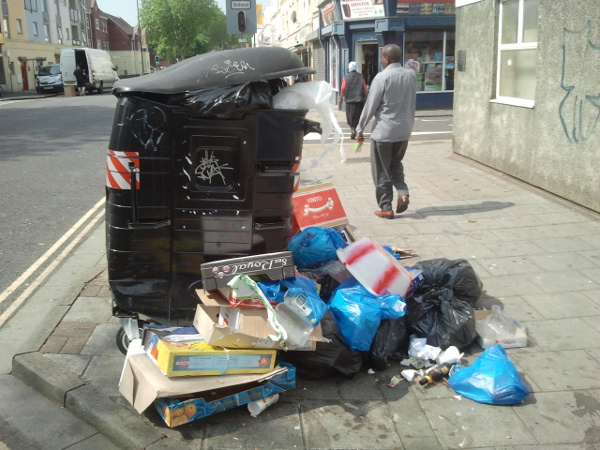 trade and other waste dumped by communal bin for household waste in Stapleton Road, Easton