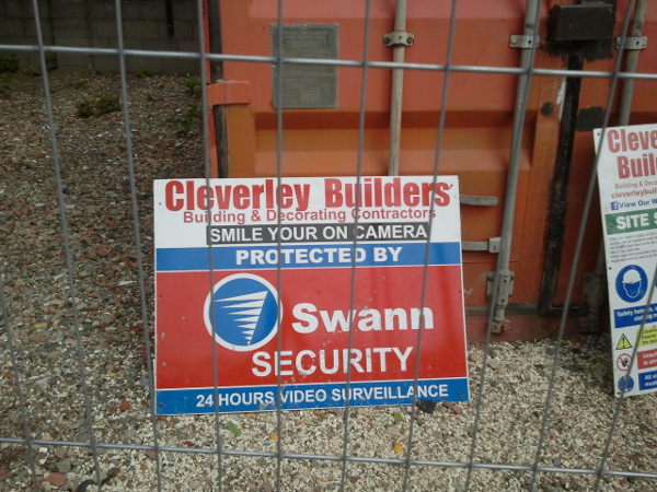 sign stating smile your on camera