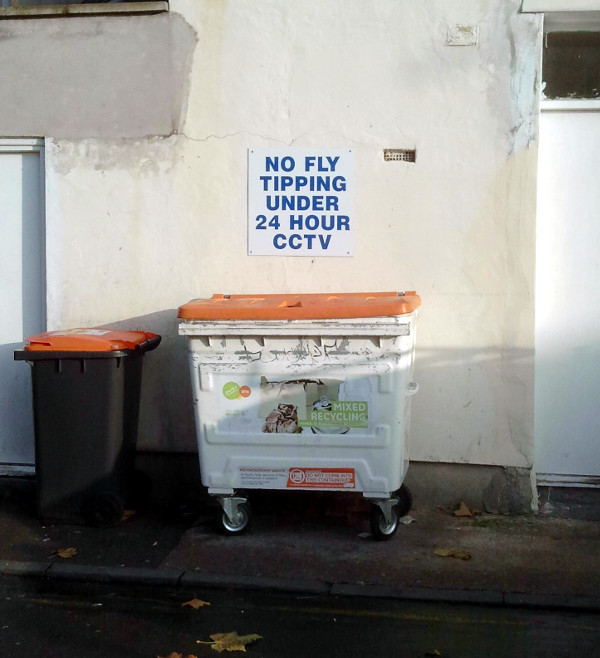 photo of bins and sign outside Sun Hing takeway on Stapleton Road