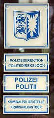 Bilingual German and Frisian police station sign