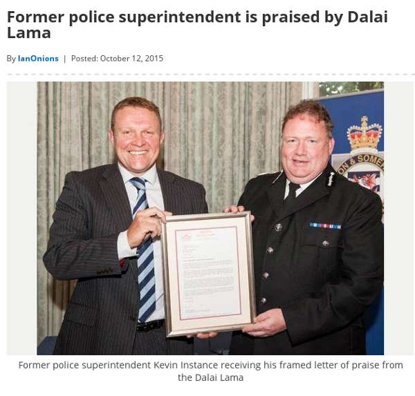 caption on image reads Former police superintendent Kevin Instance receiving his framed letter of praise from the Dalai Lama
