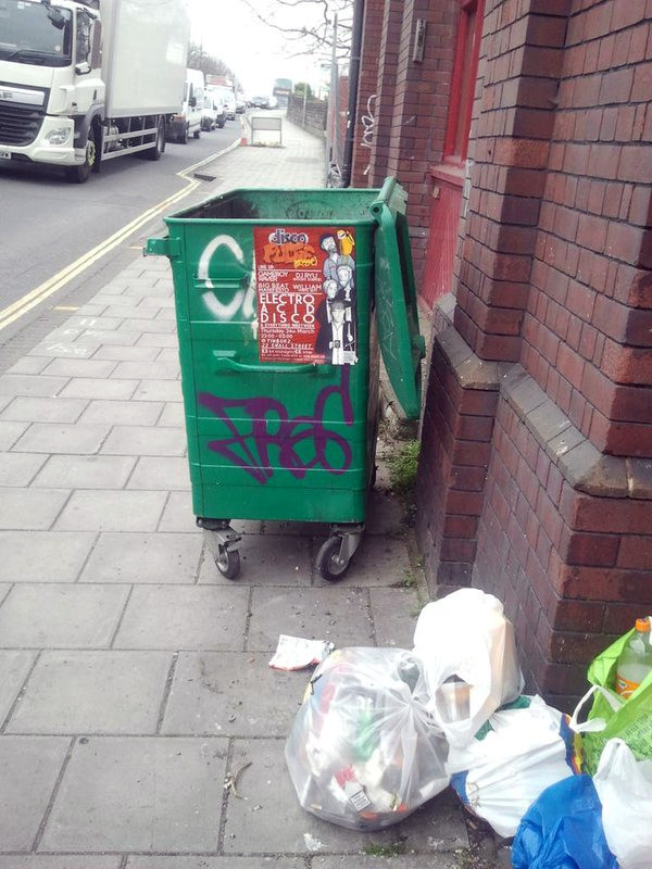 waste left by communal bin after collection
